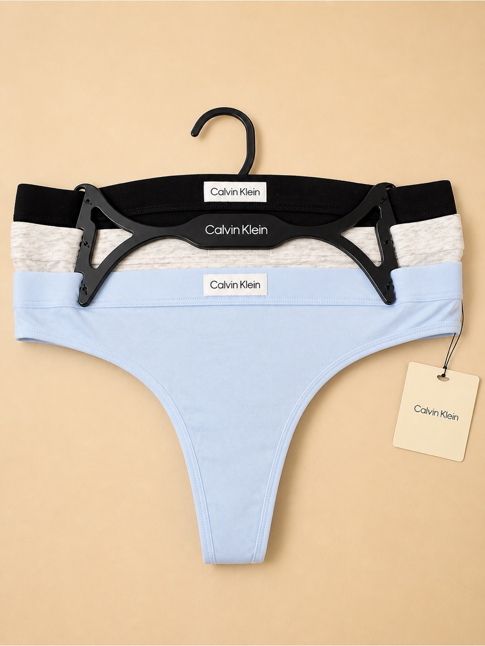 Calvin Klein Three-Pack Thongs in Black, Gray, and Light Blue